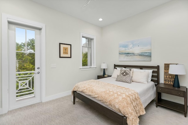 carpeted bedroom featuring access to exterior