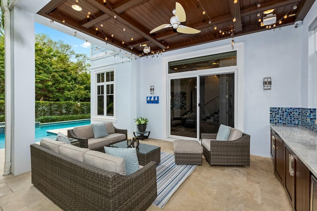 view of patio / terrace featuring ceiling fan and an outdoor living space