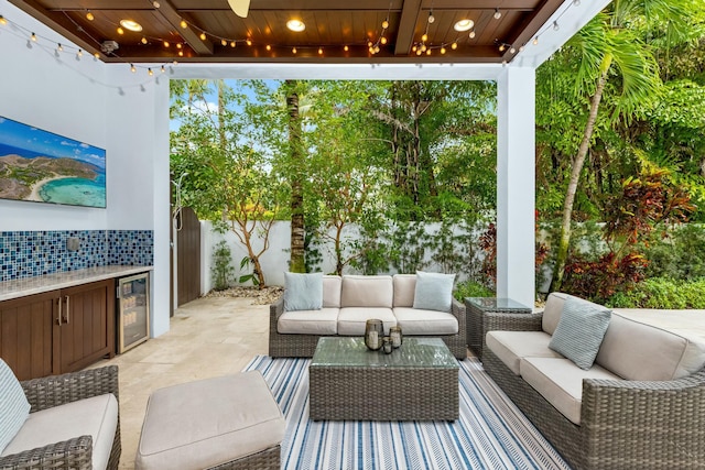 view of patio / terrace featuring wine cooler, area for grilling, and outdoor lounge area