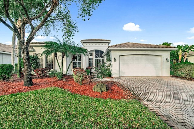 mediterranean / spanish-style house featuring a garage