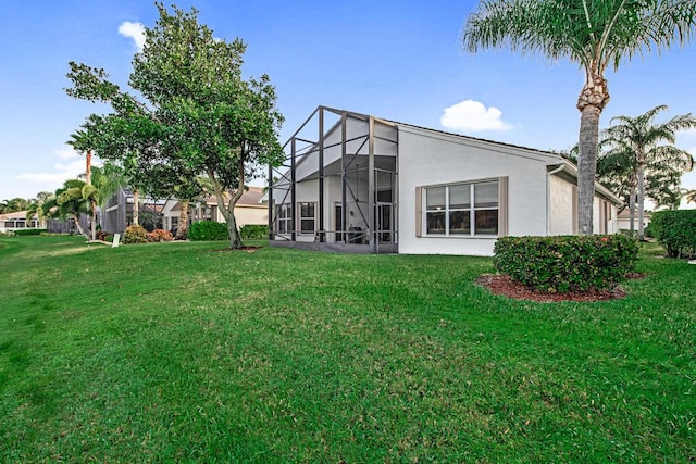 view of yard featuring glass enclosure