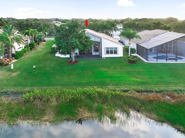 birds eye view of property featuring a water view