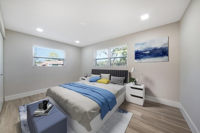 bedroom with light wood-type flooring