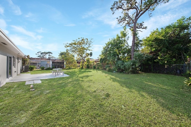 view of yard featuring a patio area and central AC unit