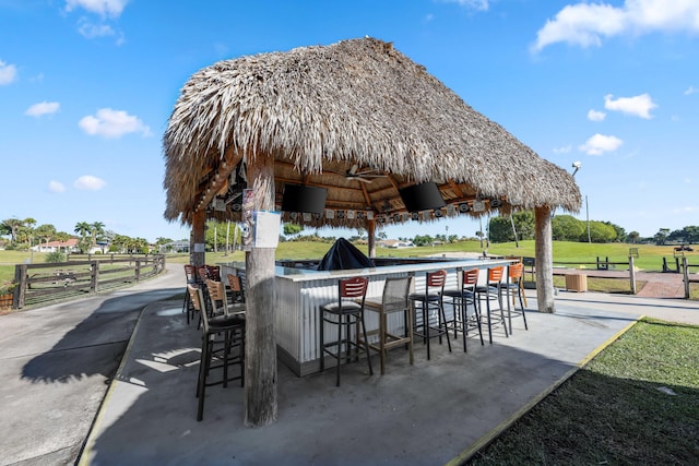 view of patio / terrace with a gazebo and a bar