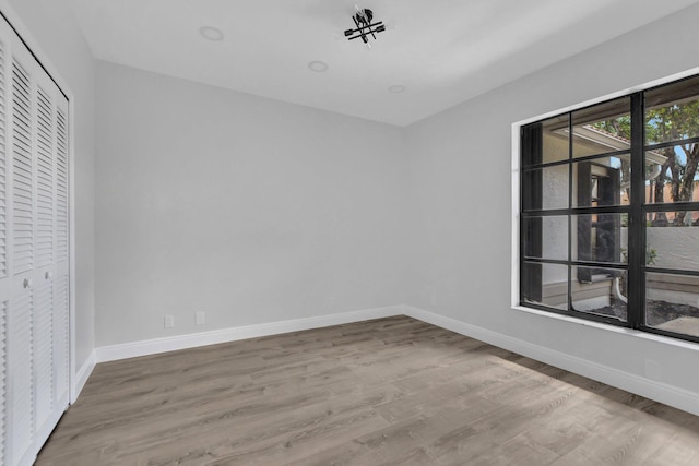 interior space with hardwood / wood-style floors and a closet