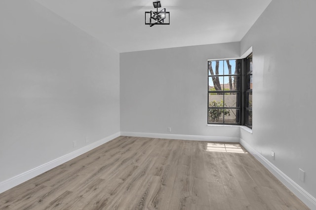 empty room with light hardwood / wood-style flooring