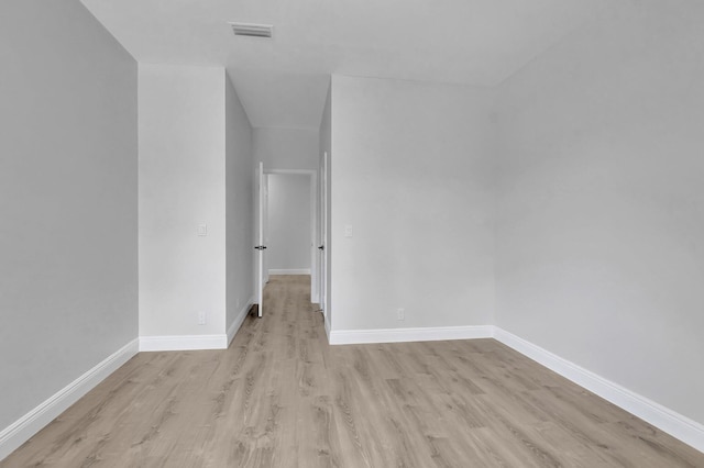 spare room featuring light wood-type flooring