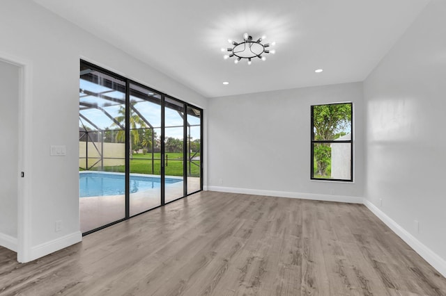 unfurnished room featuring light hardwood / wood-style flooring