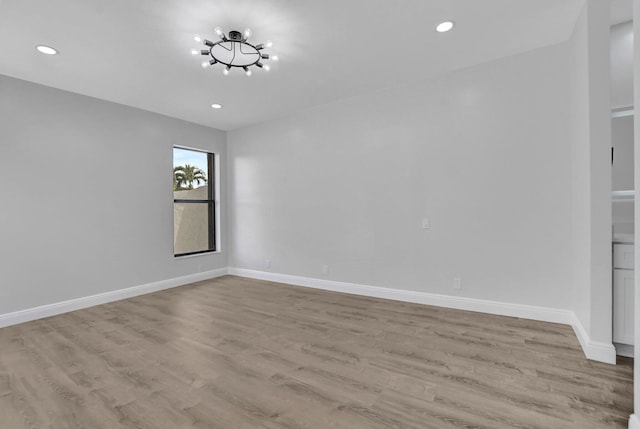 spare room featuring light wood-type flooring