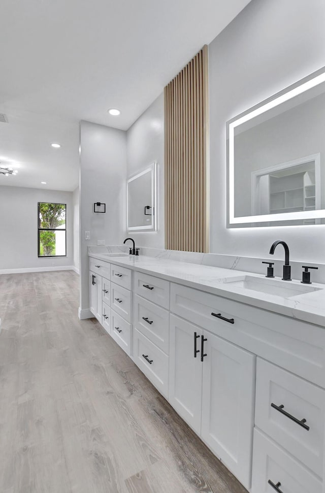 bathroom featuring hardwood / wood-style floors and vanity