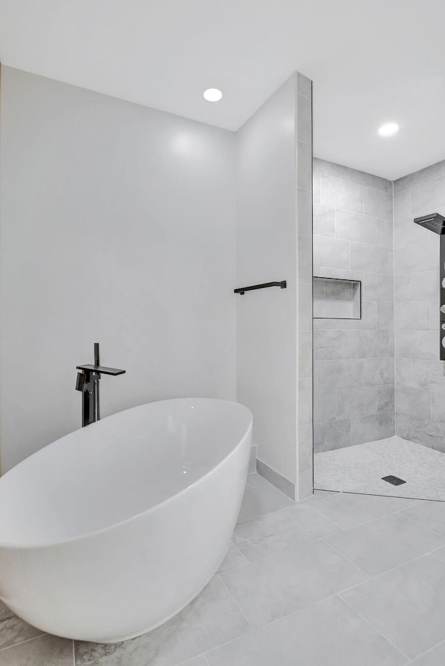 bathroom featuring separate shower and tub and sink