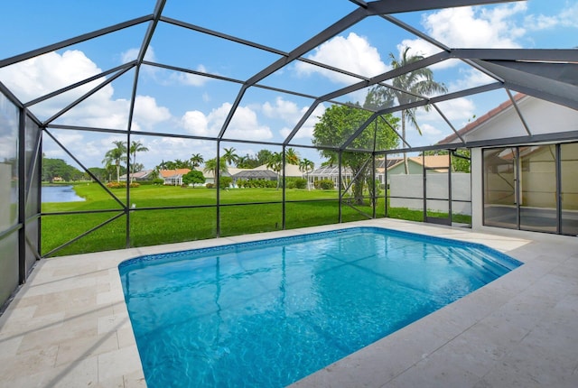 view of pool featuring a water view, glass enclosure, a patio area, and a lawn