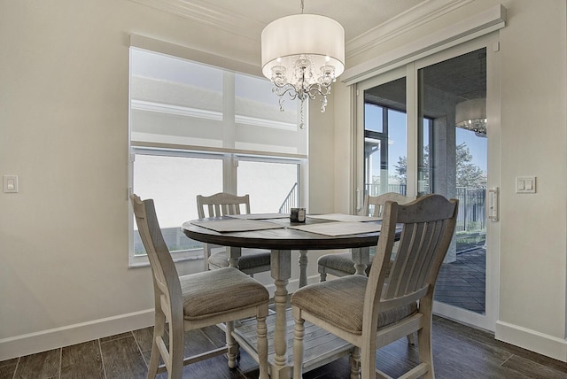 dining space with a notable chandelier and ornamental molding