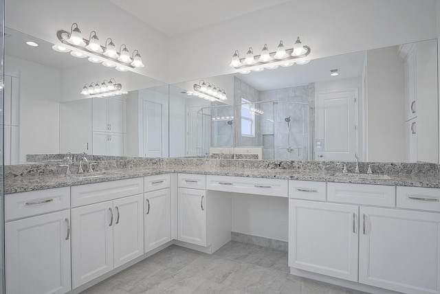 bathroom with vanity and an enclosed shower