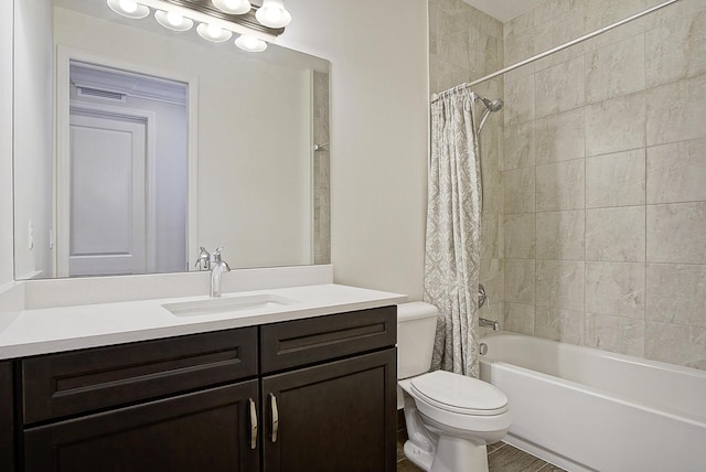 full bathroom featuring vanity, shower / bath combo, and toilet