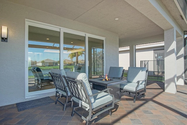 view of patio with an outdoor fire pit