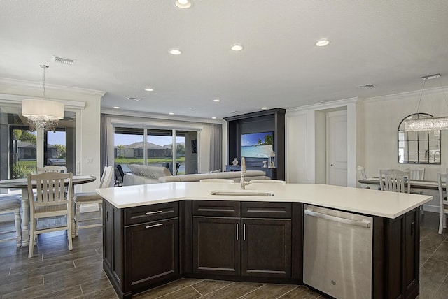 kitchen with sink, hanging light fixtures, stainless steel dishwasher, a chandelier, and a kitchen island with sink