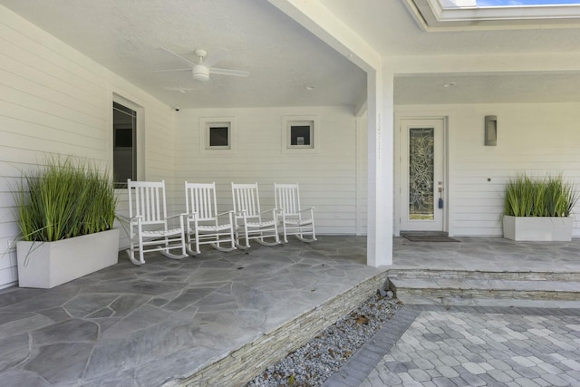 view of patio featuring ceiling fan