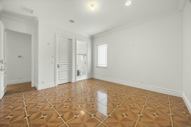 unfurnished bedroom featuring connected bathroom and ornamental molding