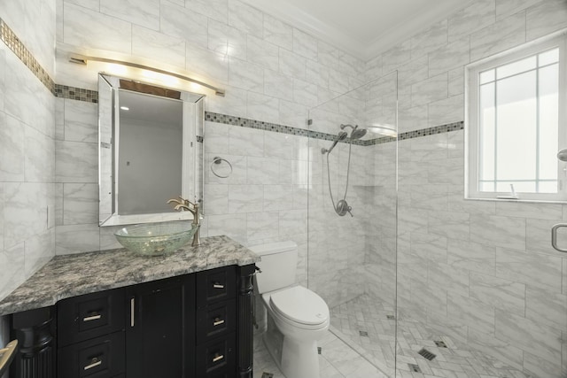 bathroom with tile walls, vanity, an enclosed shower, crown molding, and toilet