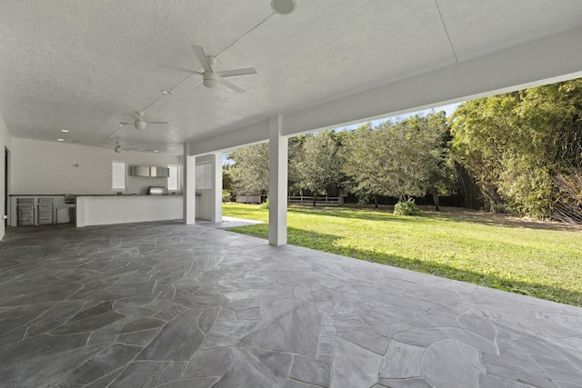 view of patio / terrace featuring ceiling fan