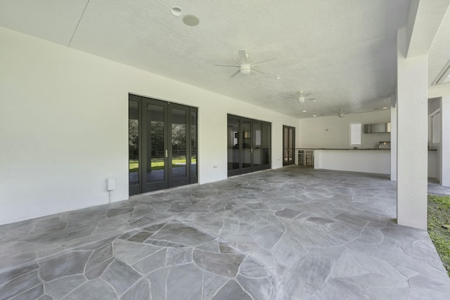 view of patio / terrace with ceiling fan and french doors