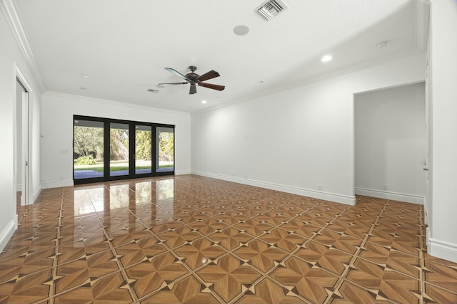 empty room featuring ceiling fan, ornamental molding, and dark parquet floors