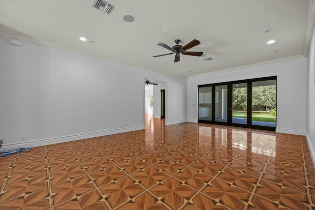 spare room with ceiling fan, a textured ceiling, and ornamental molding