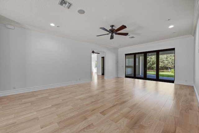 spare room with a textured ceiling, ornamental molding, ceiling fan, and light hardwood / wood-style flooring