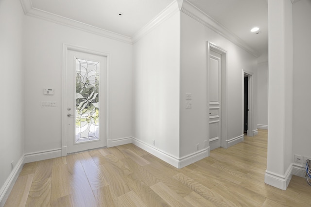 foyer featuring light hardwood / wood-style flooring and ornamental molding