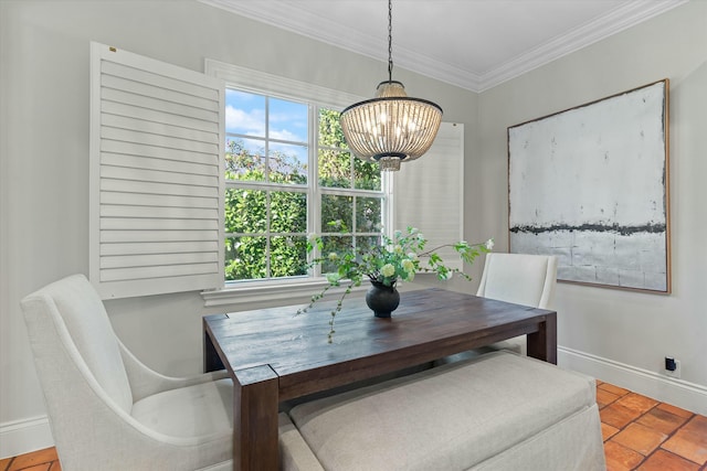 tiled dining room with a chandelier and ornamental molding