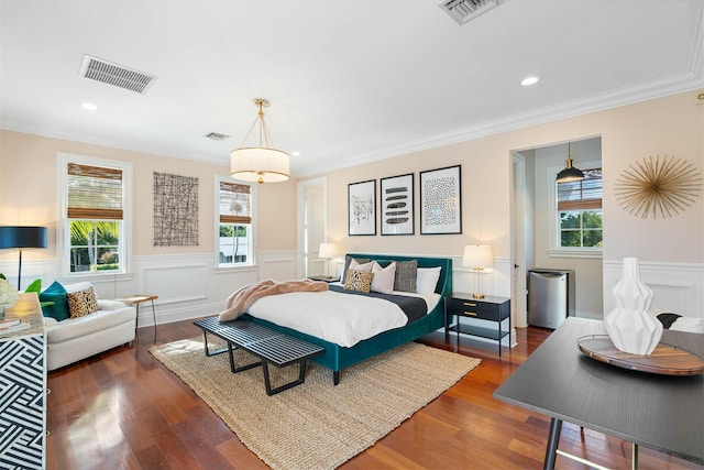 bedroom featuring dark hardwood / wood-style floors and crown molding