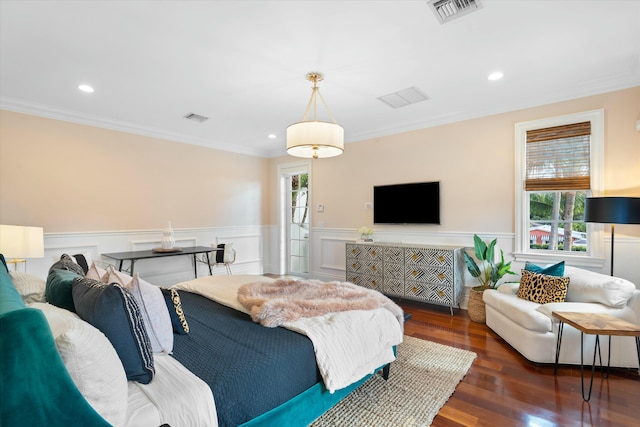 bedroom with dark hardwood / wood-style floors and crown molding