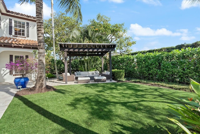 view of yard with outdoor lounge area and a pergola