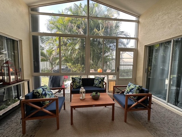 sunroom / solarium featuring lofted ceiling