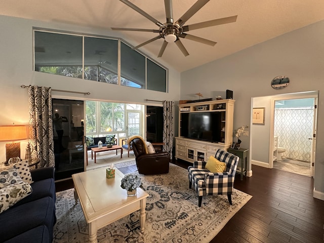 living room featuring ceiling fan, high vaulted ceiling, and dark hardwood / wood-style floors