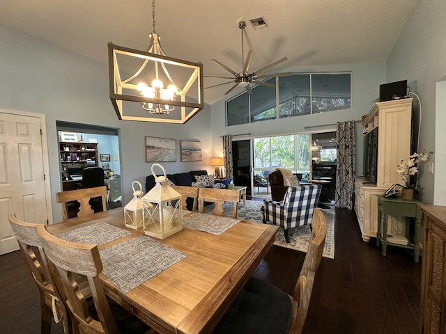 dining room featuring ceiling fan with notable chandelier, dark hardwood / wood-style flooring, and high vaulted ceiling