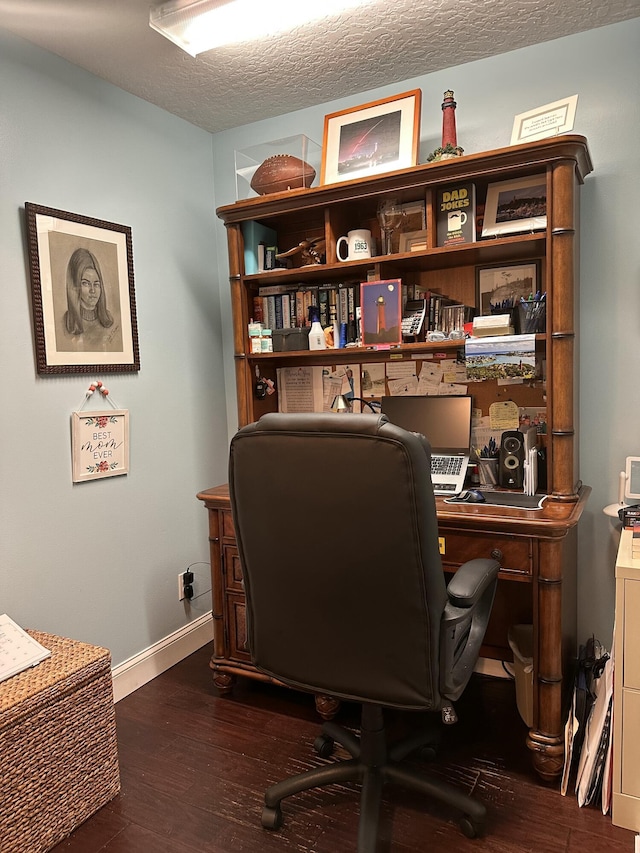 office space featuring a textured ceiling and dark hardwood / wood-style floors