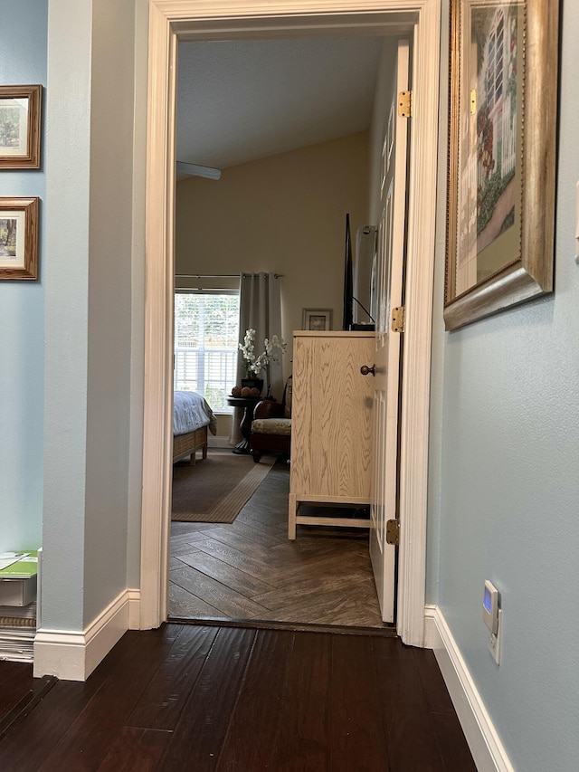 corridor featuring dark hardwood / wood-style floors