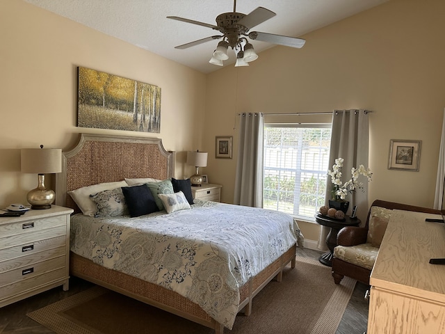 bedroom with ceiling fan and a textured ceiling