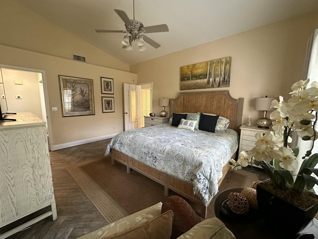 bedroom featuring dark parquet floors, vaulted ceiling, and ceiling fan