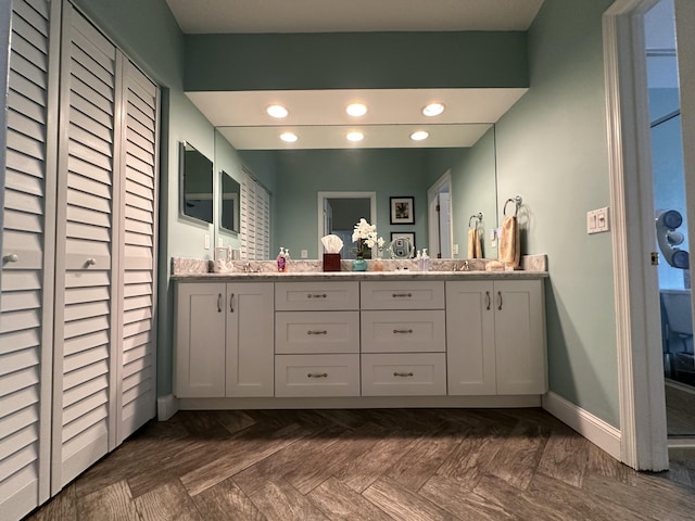 bathroom featuring vanity and parquet floors