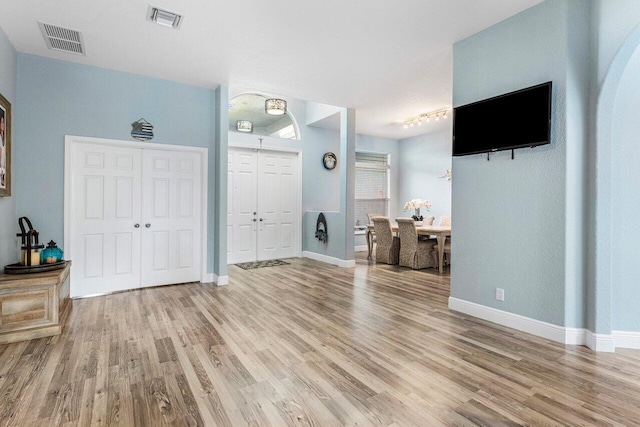 foyer with light hardwood / wood-style floors