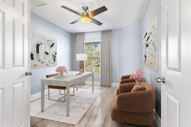 office featuring ceiling fan and light wood-type flooring