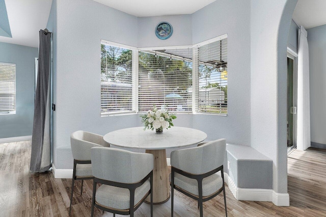 dining area with hardwood / wood-style floors