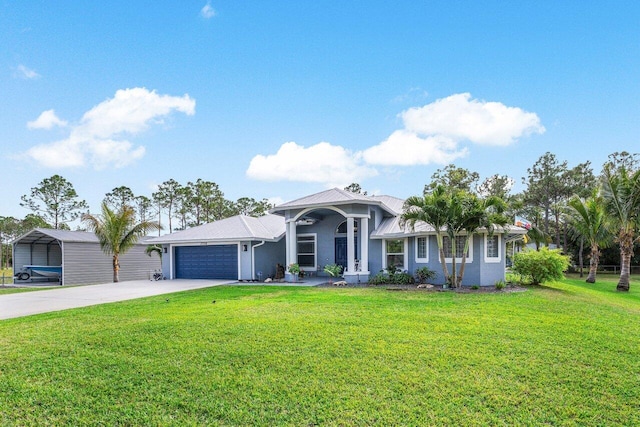 view of front of house with a garage, a front yard, and a carport