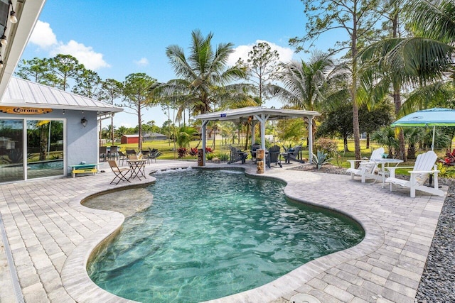 view of swimming pool with a gazebo and a patio area