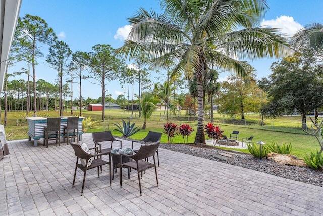 view of patio featuring an outdoor fire pit