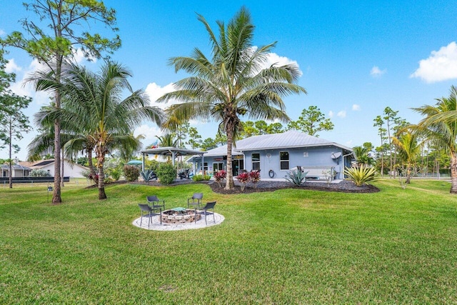 view of yard featuring an outdoor fire pit